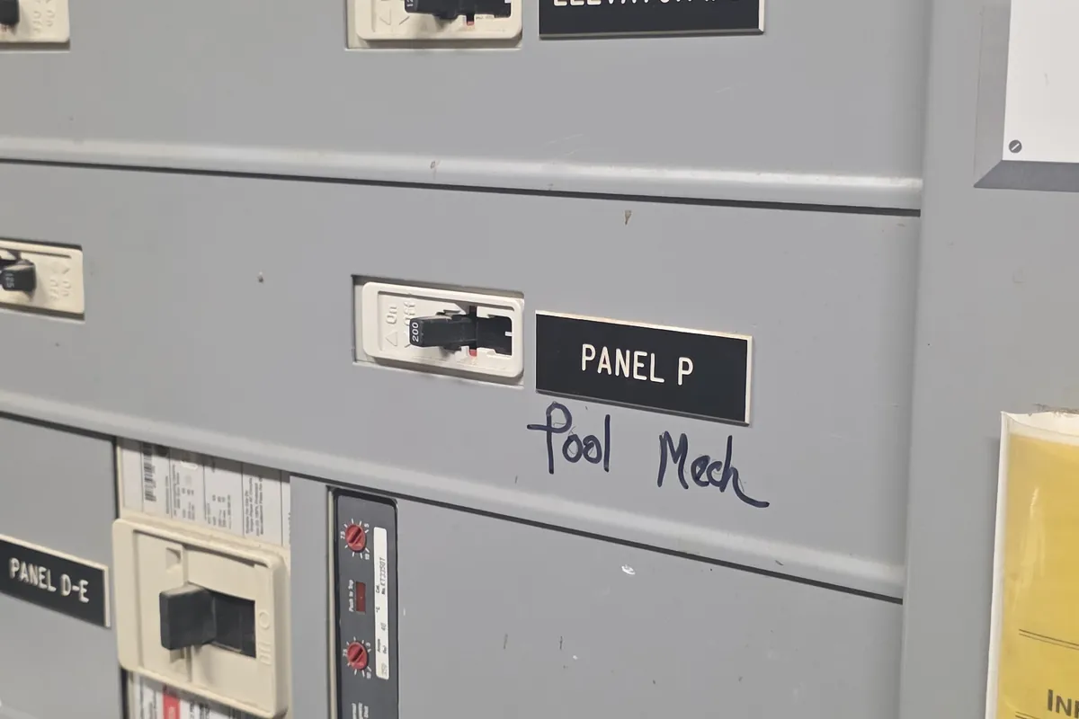Electrical room with a lineup of labelled panelboards