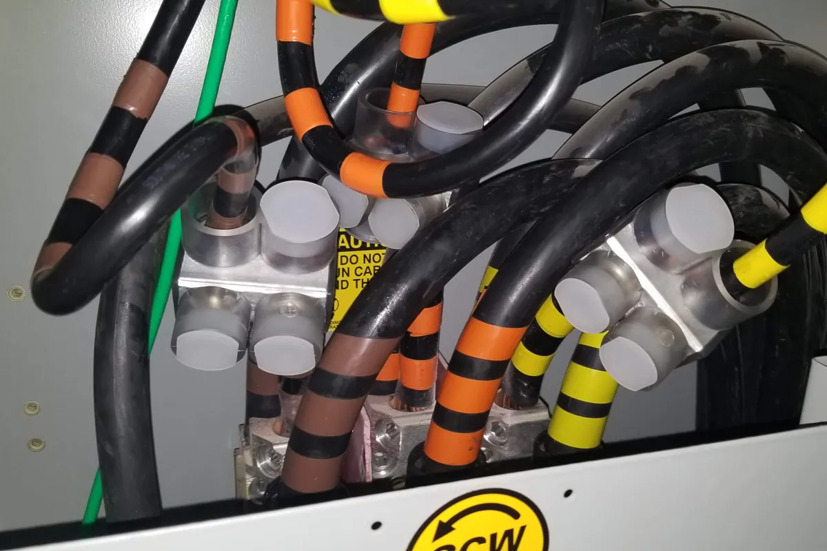 Large feeder conductors terminated and marked with phase tape