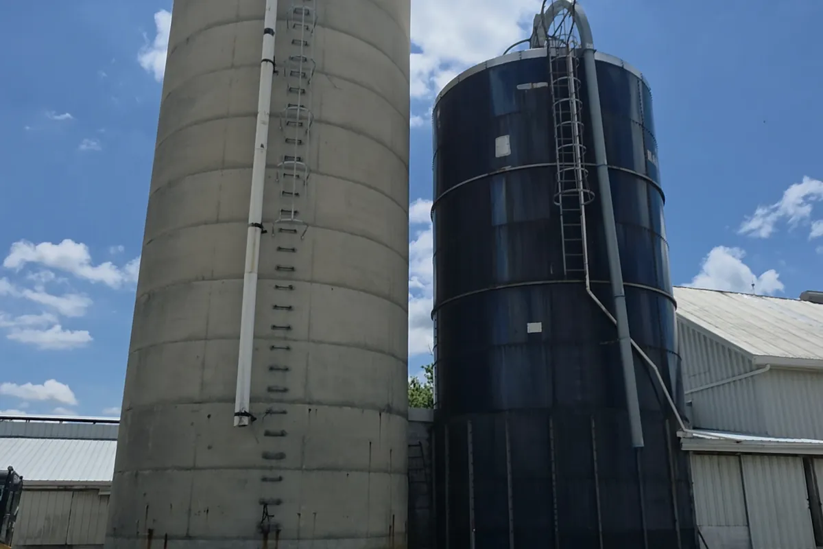 Two farm silos against the sky