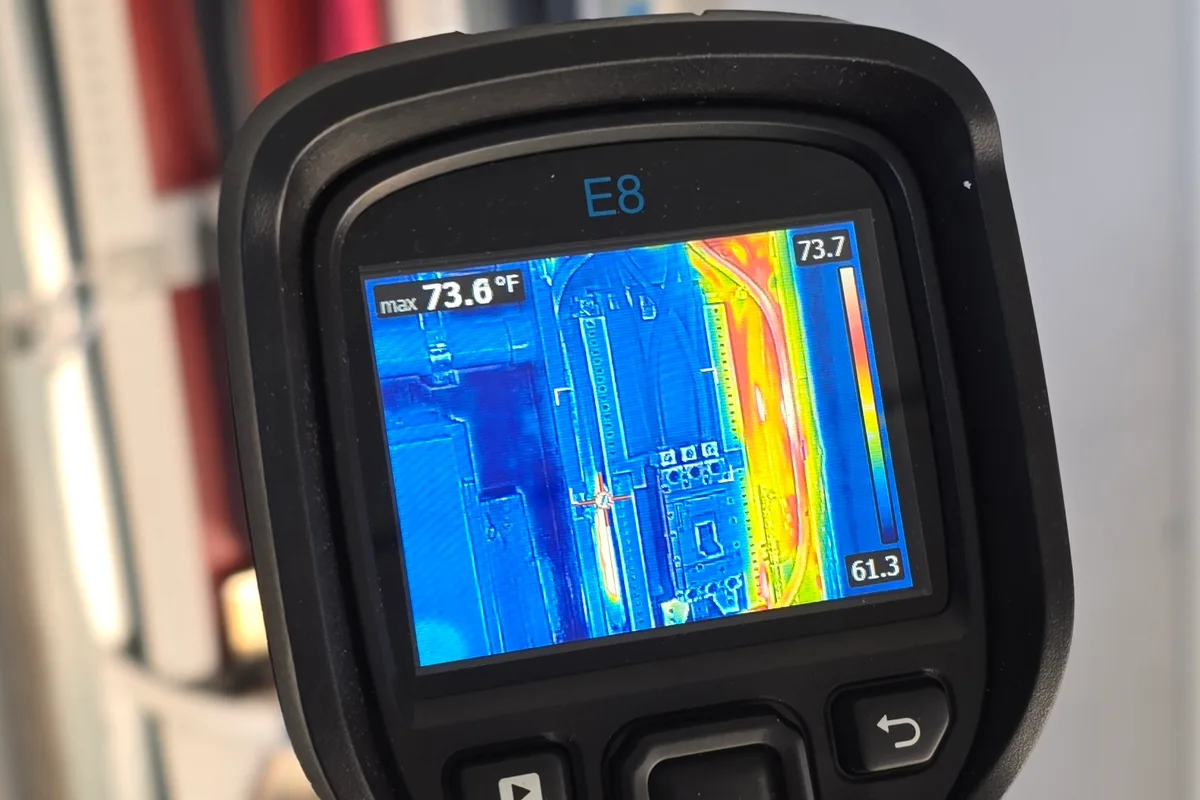 Thermal imaging camera in use during an electrical survey of live gear