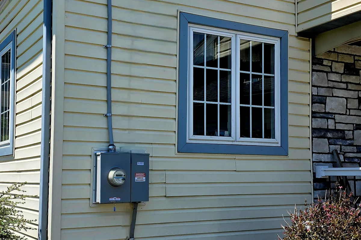Building exterior with a newly installed meter and service equipment in Womelsdorf