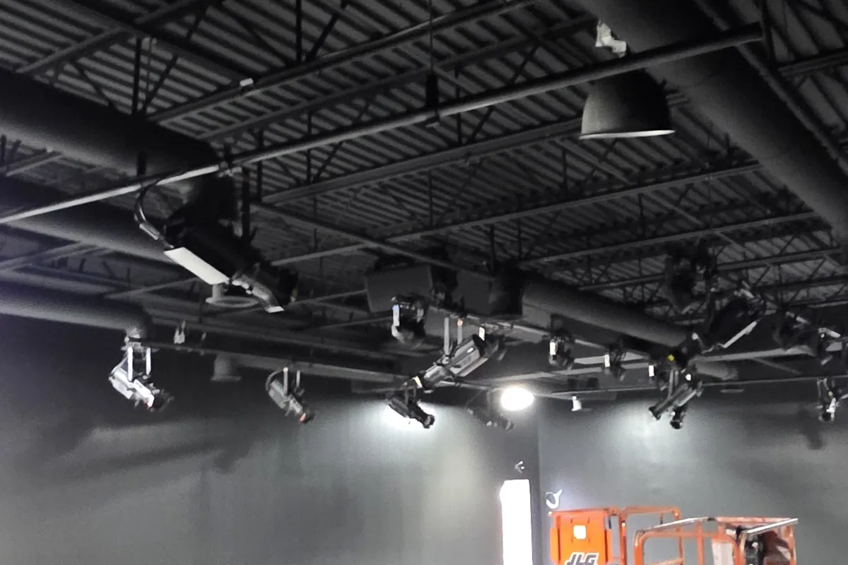 Commercial space with dark ceiling and linear lighting during fit out