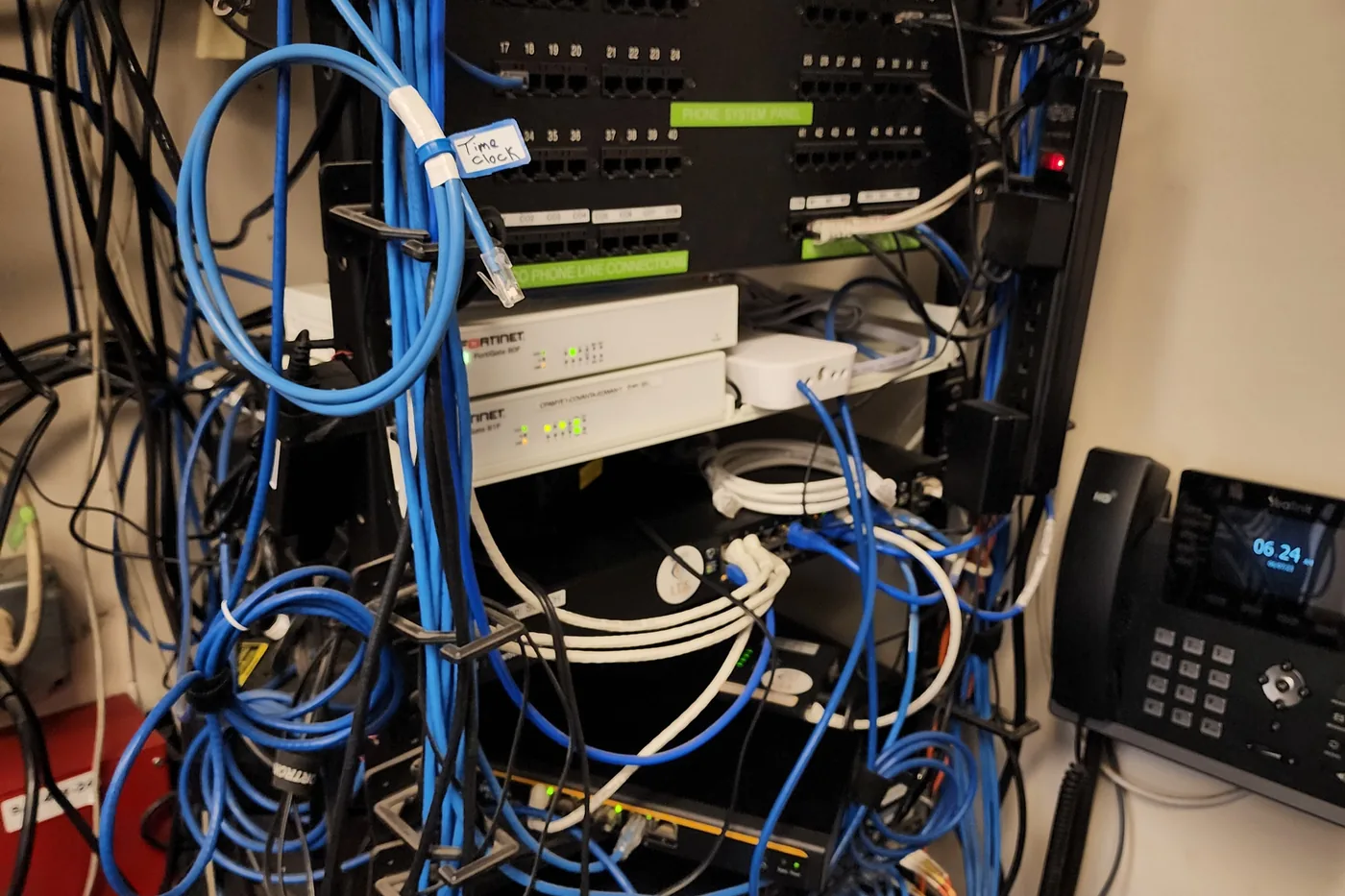 Comms room with patch panels and network cabling